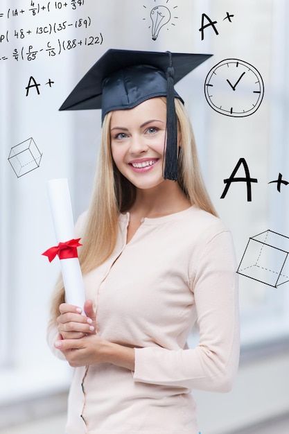 education and school concept - happy student in graduation cap with certificate