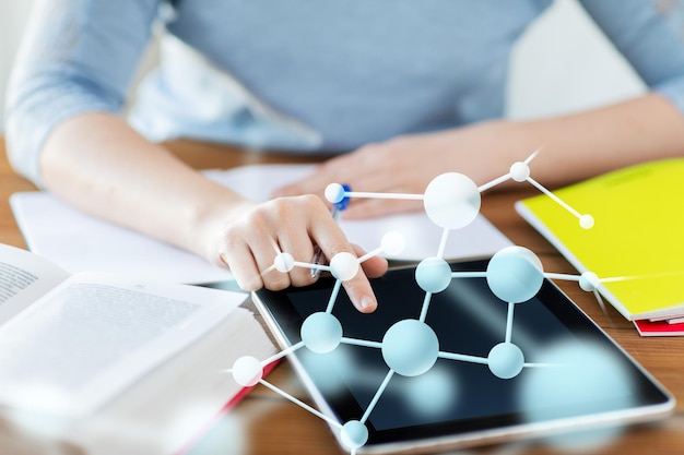 education, science, technology and people concept - close up of student woman with molecule formula tablet pc computer and notebook at home