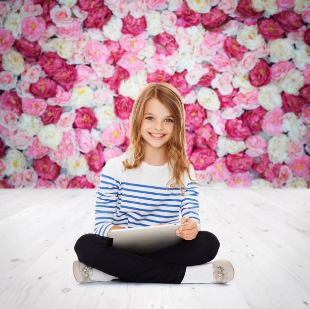 education, technology and internet concept - little student girl with tablet pc