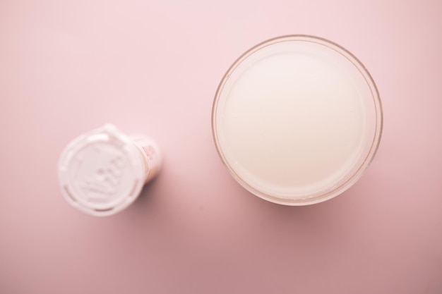 Effervescent soluble tablet pills and glass of water on table