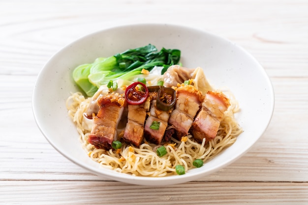 egg noodle soup with crispy pork belly and wonton