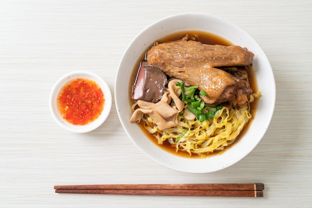 Egg noodles with stewed and braised duck in brown soup