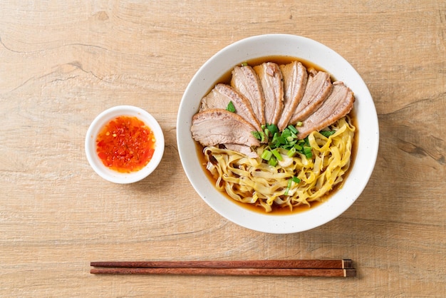 Egg noodles with stewed duck in brown soup