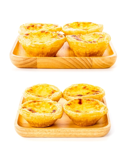 Egg tart the delicious crispy bekery on wooden plate isolated on white background