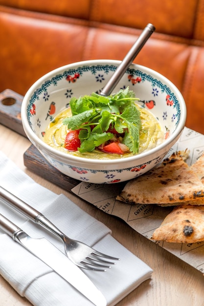 Eggplant caviar garnished with fresh herbs and pastries