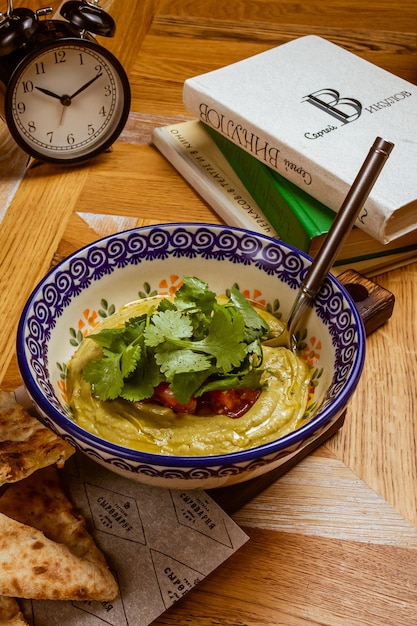 Eggplant caviar garnished with fresh herbs and pastries