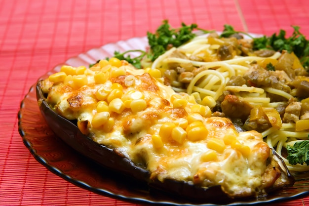 Eggplant with filling and noodles