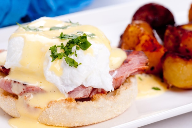 eggs benedict with farm fresh eggs and ham and fried potatoes