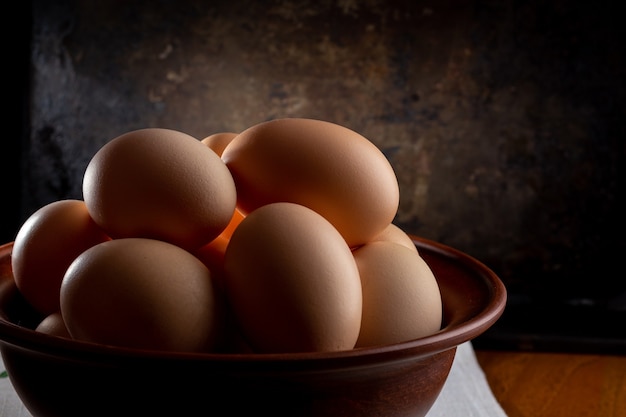 Eggs in a bowl on a wooden table