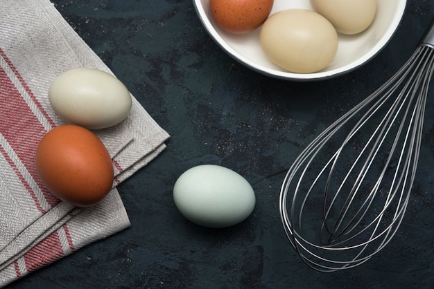 Eggs with beater on table