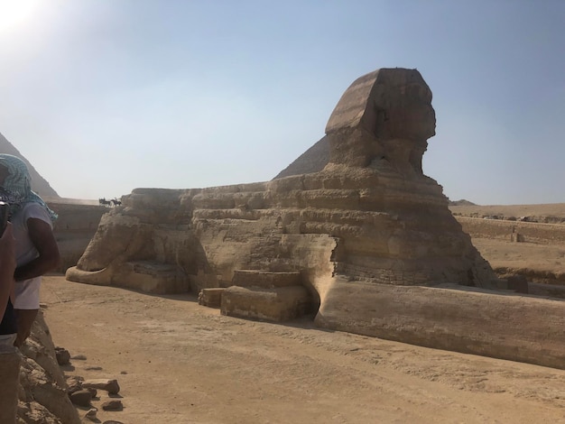 Egypt Cairo Ancient pyramids Giza Sphinx A large rock formation with the word god on it