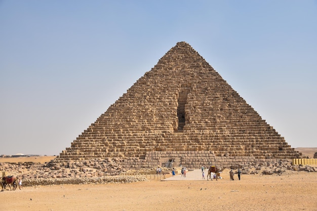 Egypt The Pyramid of Cheops A pyramid with a pyramid in the background and a horse in front of it