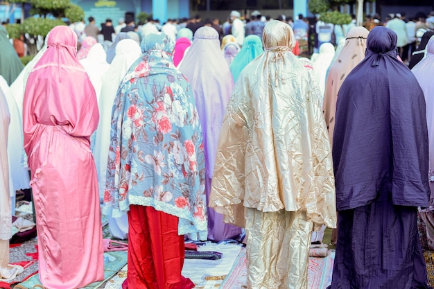 Eid prayer by Muslims in the field. Eid al-Fitr is a Muslim holiday after the fast of Ramadan.