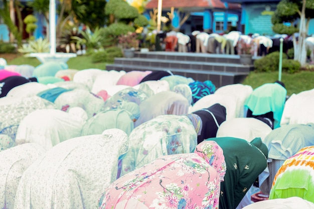 Eid prayer by Muslims in the field. Eid al-Fitr is a Muslim holiday after the fast of Ramadan.