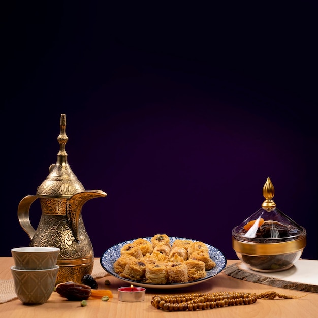 Eid and Ramadan set with Arabian coffee and dates and Arabian sweets ana tasbeeh