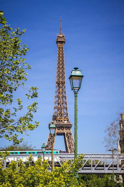 Eiffel Tower and subway on a bridge in Paris France