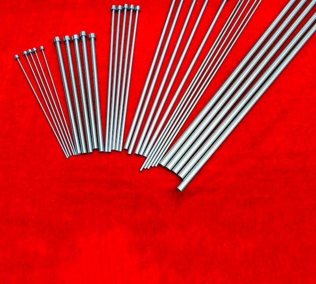 Ejector steel pins for injection moldtooling   industrial engineering background with copy space