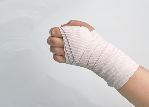 Elastic bandage roll support hand wrist and finger isolated on white