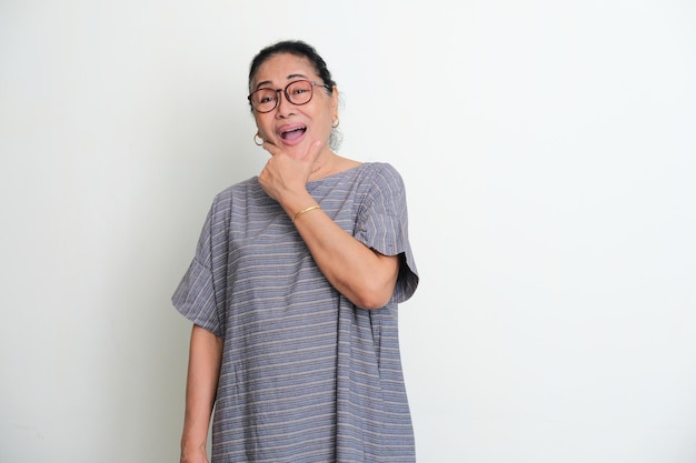 Elderly Asian woman laughing happy to the camera