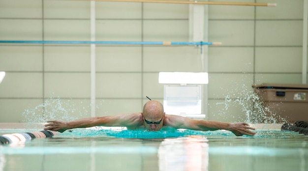 Elderly athlete swimming