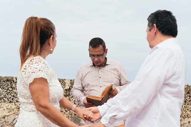 Elderly couple during outdoor wedding ceremony