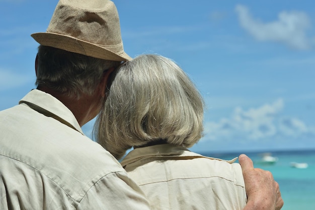 Elderly couple rest at tropical resort