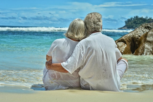 Elderly couple rest at tropical resort