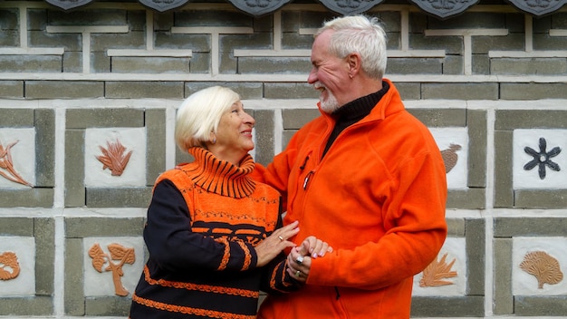 Elderly grayhaired optimistic couple