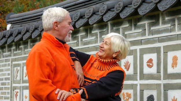 Elderly grayhaired optimistic couple