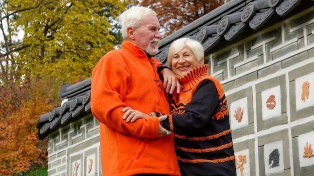 Elderly grayhaired optimistic couple