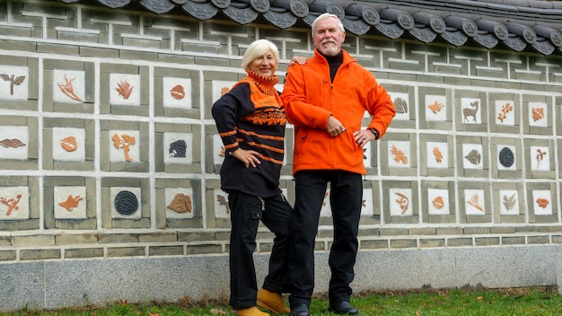 Elderly grayhaired optimistic couple