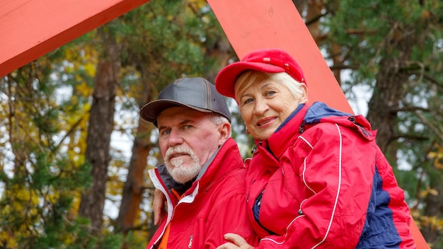 Elderly grayhaired optimistic couple