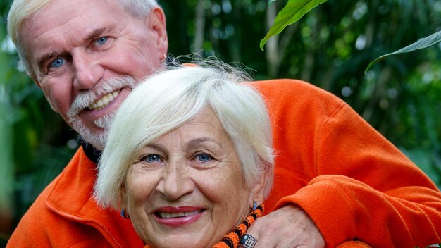 Elderly grayhaired optimistic couple