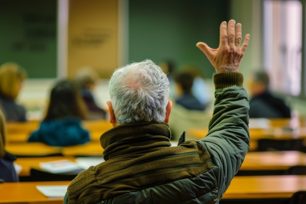 Elderly man actively participating in a classroom setting raising his hand to ask a question among younger students