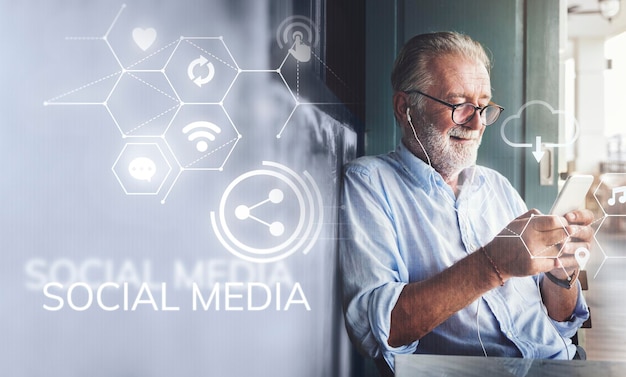 Elderly man watching an online movie from his phone