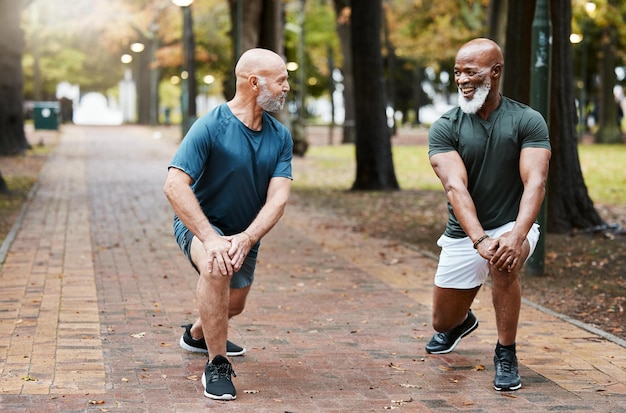 Elderly men training and stretching for morning workout in the park or forest Senior lunges exercise and motivation for wellness fitness and healthcare strong legs cardio or running outdoors