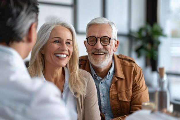 Elderly pair engaging with insurance company staff cheerfully