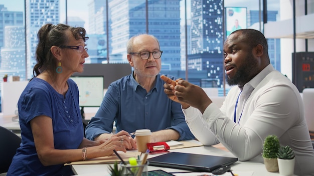 Elderly pair meeting with a financial expert to explore retirement strategies