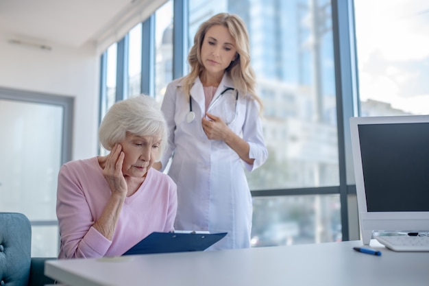 Elderly patient feeling shocked after reading the test results