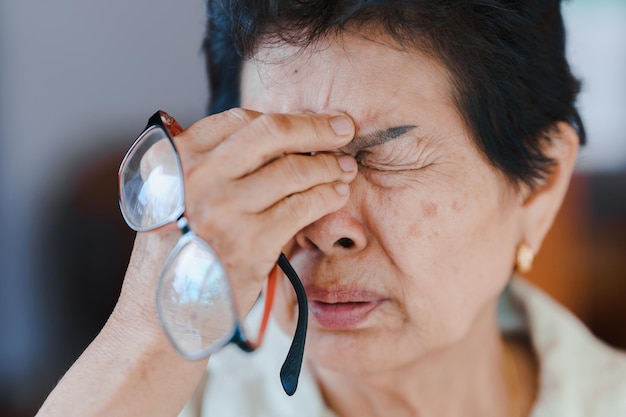 Elderly people have eye strain due to overuse of eyes or stress.