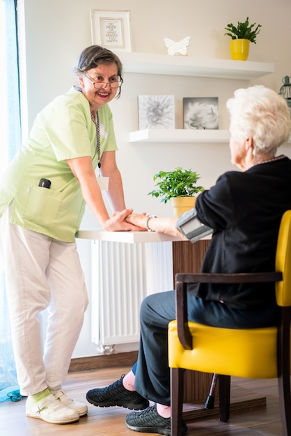 Elderly woman needs care of medical nurse