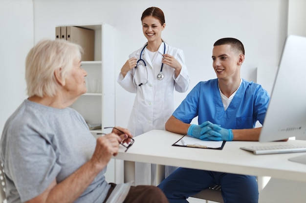 Elderly woman patient at doctor39s appointment and nurse treatment