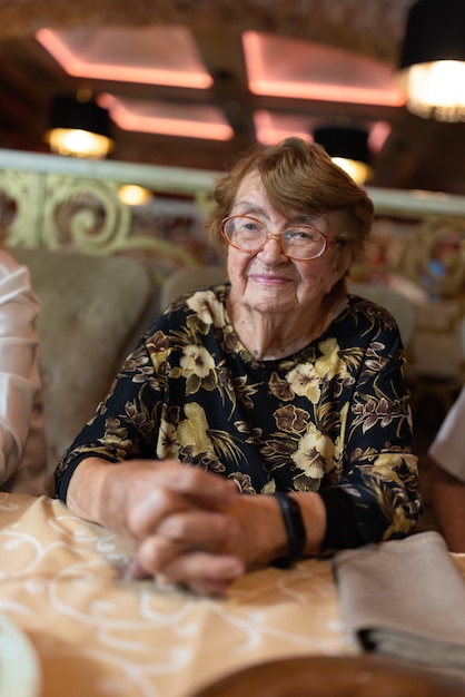 Elderly woman at the restaurant