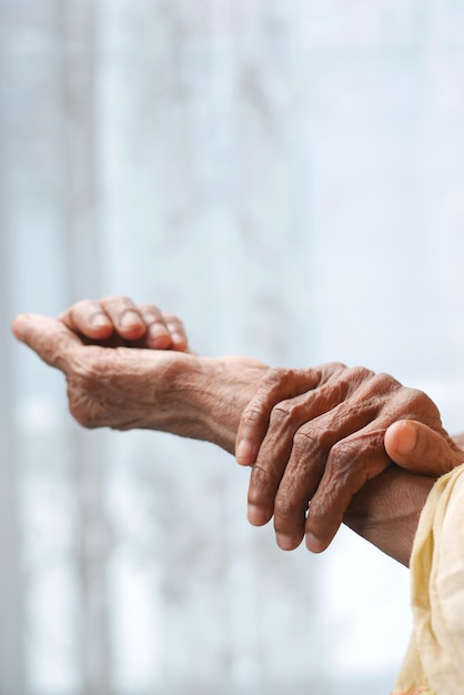 Elderly woman suffering from pain isolated on white