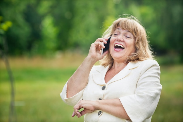 Elderly woman talking on the phone