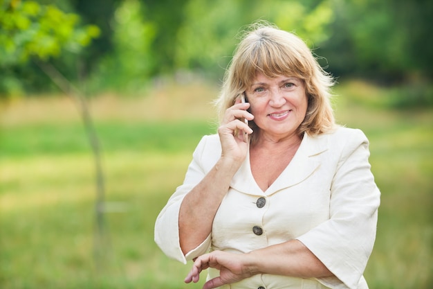 Elderly woman talking on the phone