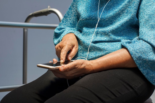 Elderly woman using mobile phone