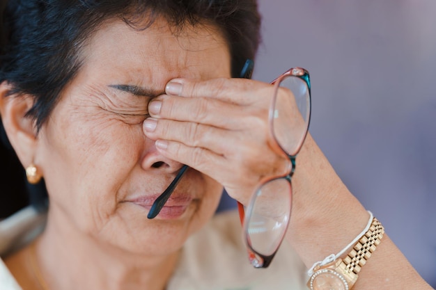 Elderly women with eye disease causing a lot of pain in the eyes.