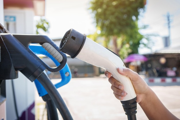 Electric car battery charging at charge station