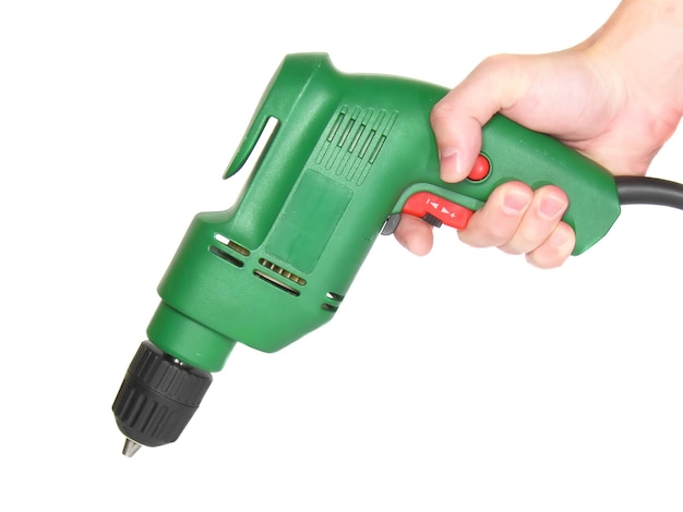 Electric drill in a hand isolated on white background